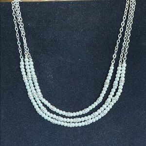 Silver and White Multi-Strand Necklace with Shimmering Beads